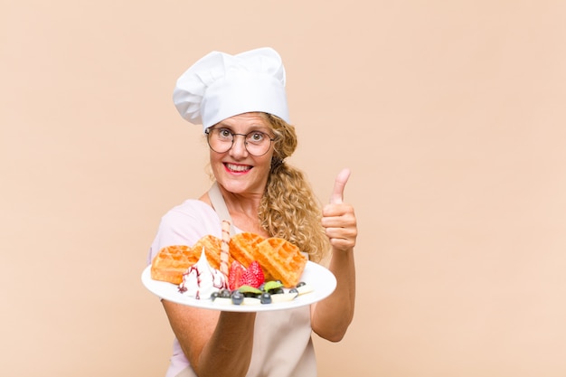 Uśmiechnięty kucharz z talerzem